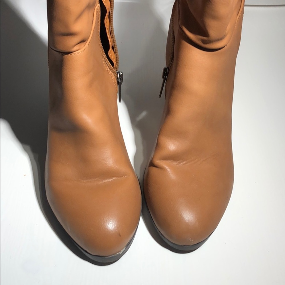 Camel colored knee-high boots with 4 inch heels